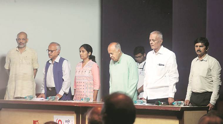 (Mukta Dabholkar (centre) and Jayant Narlikar (fourth from left) at the event on Sunday. (Express photo/Pavan Khengre)