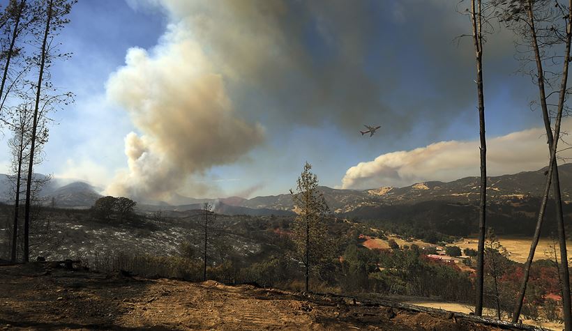 California's largest wildfire surges as temperature rises