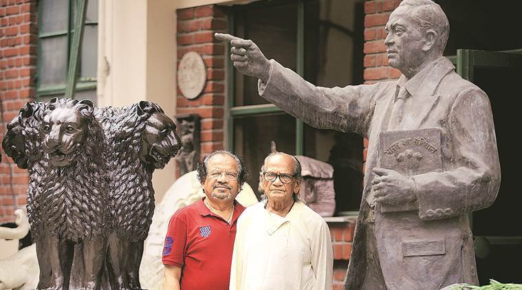 Sutar with his son at his studio in Noida.(Express photo/Praveen Khanna)