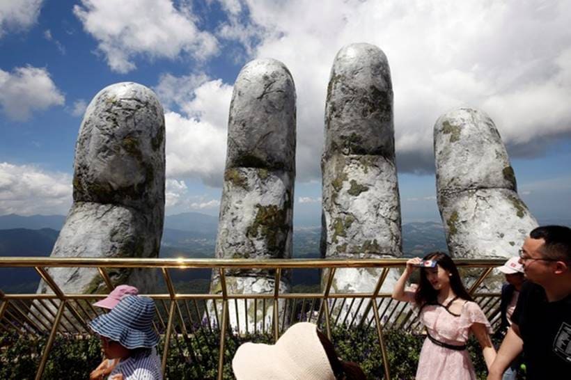 In the hands of the gods: Vietnam's Golden Bridge has giant support