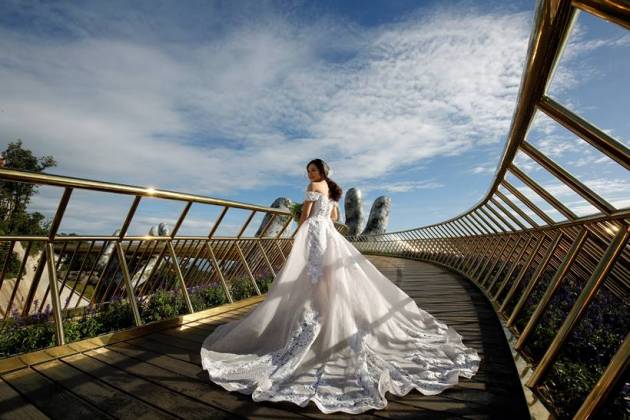 In the hands of the gods: Vietnam's Golden Bridge has giant support