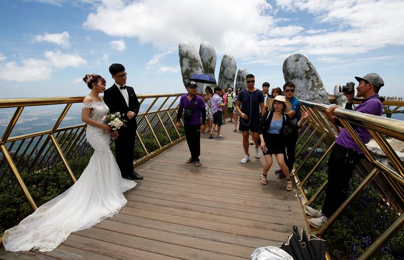In the hands of the gods: Vietnam's Golden Bridge has giant support