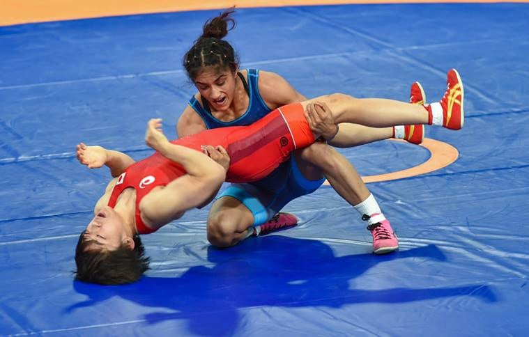 India's Vinesh Phogat (blue) in action against Japan's Yuki Irie during the final bout of women's freestyle 50 kg wrestling event, at the Asian Games 2018, in Jakarta
