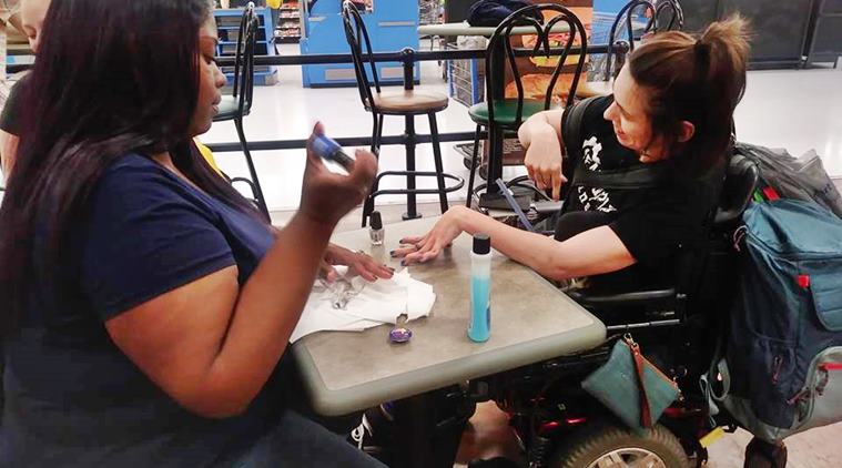walmart, cashier helps cerebral palsy woman, cerebral palsy woman denied nail salon, cashier manicures cerebral palsy woman, good news, viral news, indian express