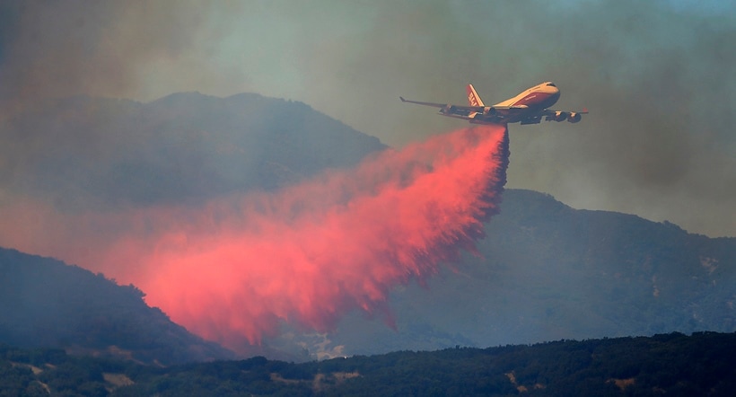 California's largest wildfire surges as temperature rises