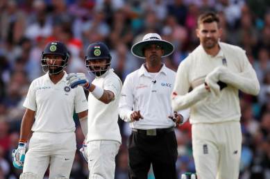 India's Virat Kohli talks to England's James Anderson