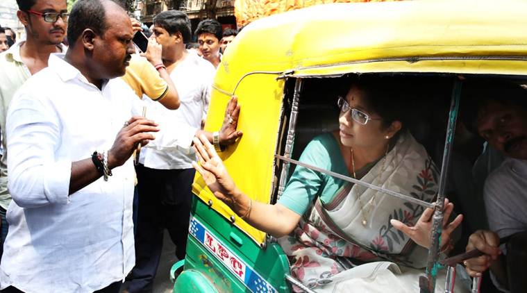 Bengal minister Shashi Panja in an auto at a TMC rally in Burrabazar area in Kolkata. (Express photo/Partha Paul)