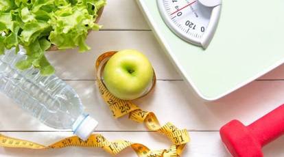 Premium Photo  Health diet and woman with scale and apple to