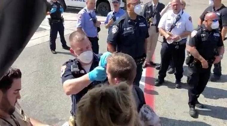 Passengers are assisted by the air cabin crew and the emergency services on a flight from New York to Dubai, at JFK Airport, New York, on Wednesday. (Reuters)