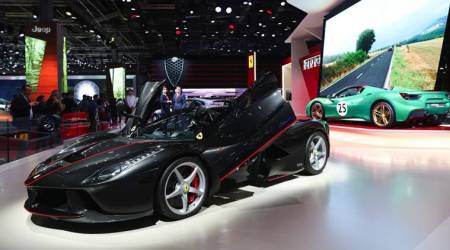 A LaFerrari Aperta automobile, produced by Ferrari NV, sits on the company's stand during the second press day of the Paris Motor Show at Porte de Versailles exhibition center in Paris, France, on Friday, Sept. 30, 2016. Ford Motor Co. and Rolls-Royce are among the companies skipping the car show, also known as Mondial de L'Automobile, as the once-unmissable event succumbs to changes sweeping the auto industry. Photographer: Jasper Juinen/Bloomberg