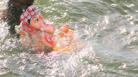 ganesh idol immersion, Surat municipal corporation, idol immersion in artificial ponds, idol immersion in water filled vessels, idol immersion procession, Ahmedabad, indian express