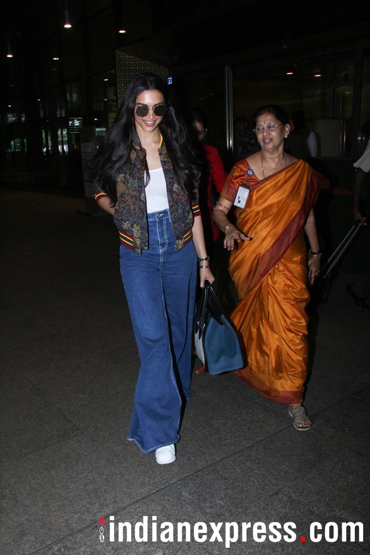 Deepika Padukone flaunts casual style in coat and denim jeans at Mumbai  airport. Wow pics - India Today