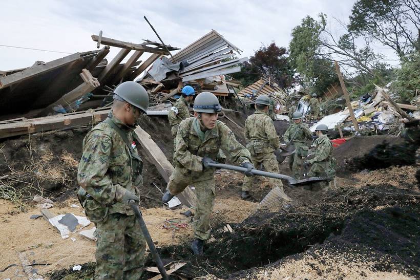Japan earthquake toll rises as rescuers dig through landslides