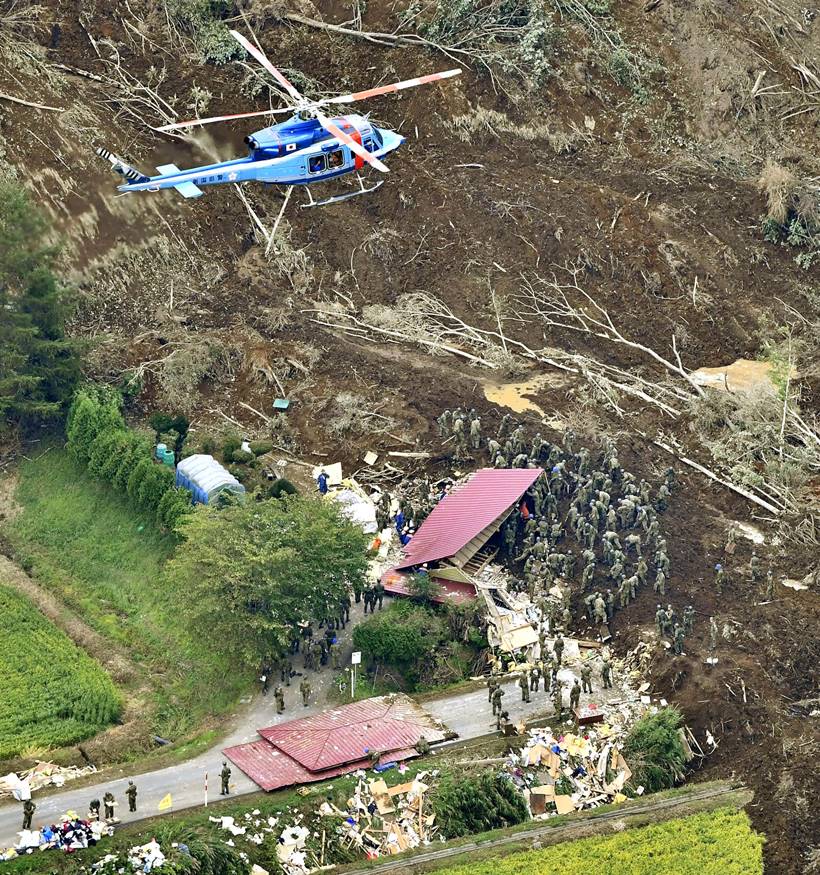 Japan earthquake toll rises as rescuers dig through landslides