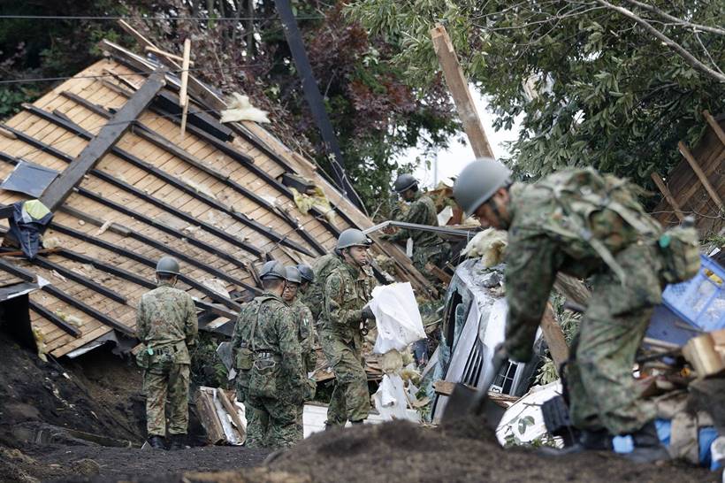 Japan earthquake toll rises as rescuers dig through landslides