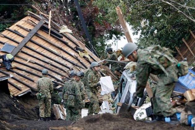 Japan earthquake toll rises as rescuers dig through landslides