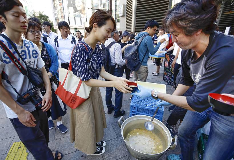 Japan earthquake toll rises as rescuers dig through landslides
