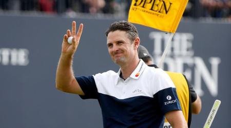 England's Justin Rose gestures to fans on the 18th during the final round