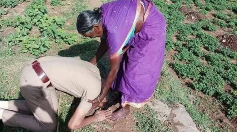 police touching mother feet, cop bowing down to mother, cop salute mother, mother sacrifice karnataka cop, karnataka news, social media news, viral photo, indian express