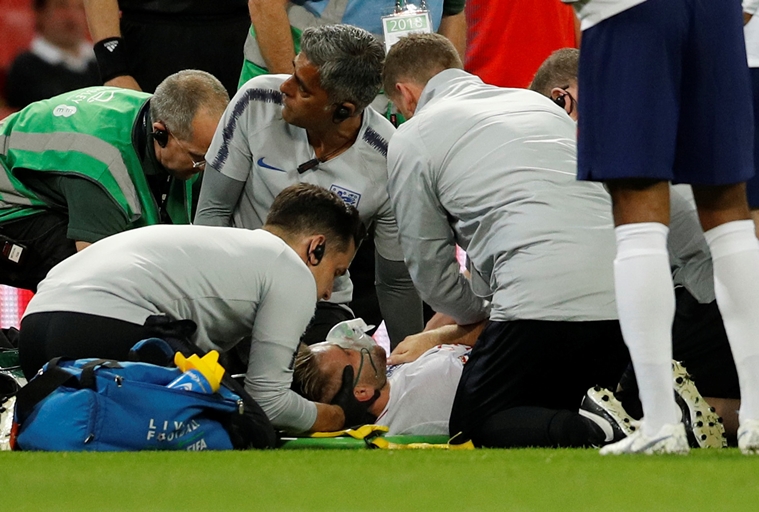England's Luke Shaw receives medical treatment after sustaining an injury