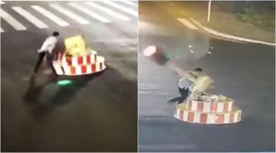 Video: Tired of waiting at traffic signal, man knocks it down! | Trending News,The Indian Express Video: Tired of waiting at traffic signal, man knocks it down! | Trending News,The Indian Express