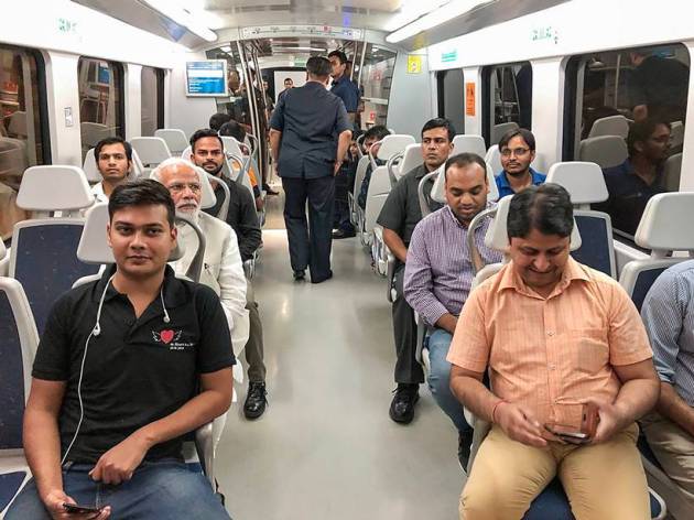 PM Modi poses for selfies on Airport Metro ride to Dwarka event