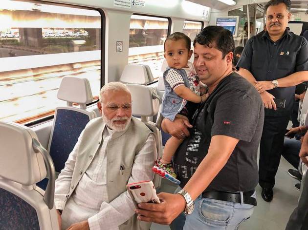 PM Modi poses for selfies on Airport Metro ride to Dwarka event
