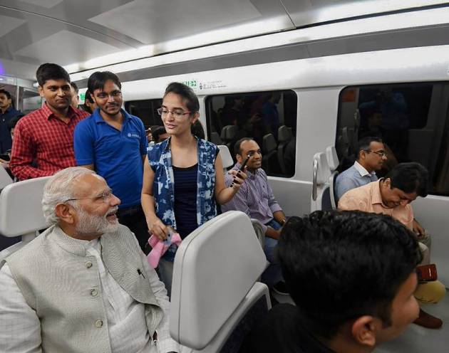 PM Modi poses for selfies on Airport Metro ride to Dwarka event