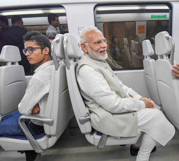PM Modi poses for selfies on Airport Metro ride to Dwarka event