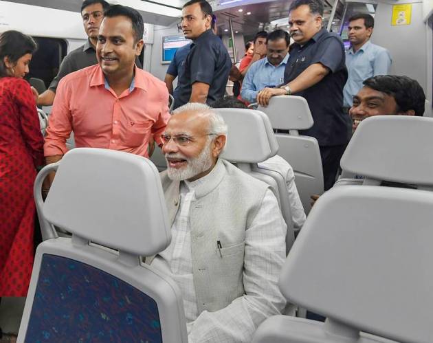 PM Modi poses for selfies on Airport Metro ride to Dwarka event
