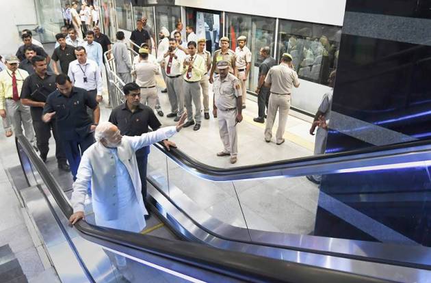 PM Modi poses for selfies on Airport Metro ride to Dwarka event