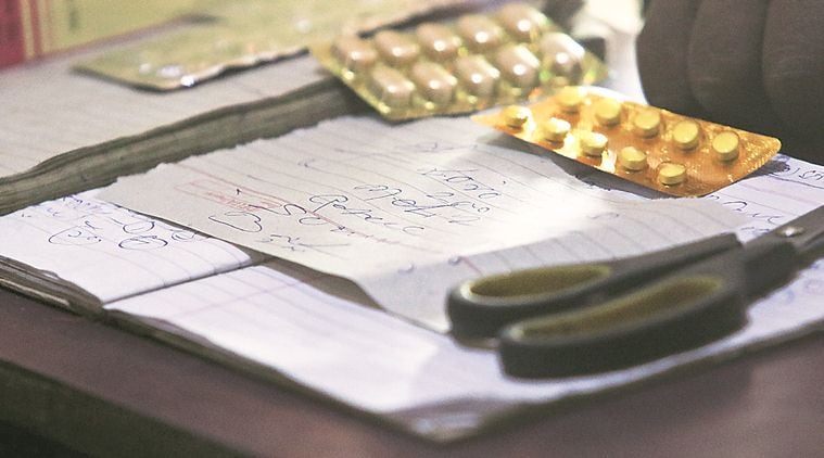 In Mewat, an unregistered medical practitioner writes a prescription. (Photo: Praveen Khanna)