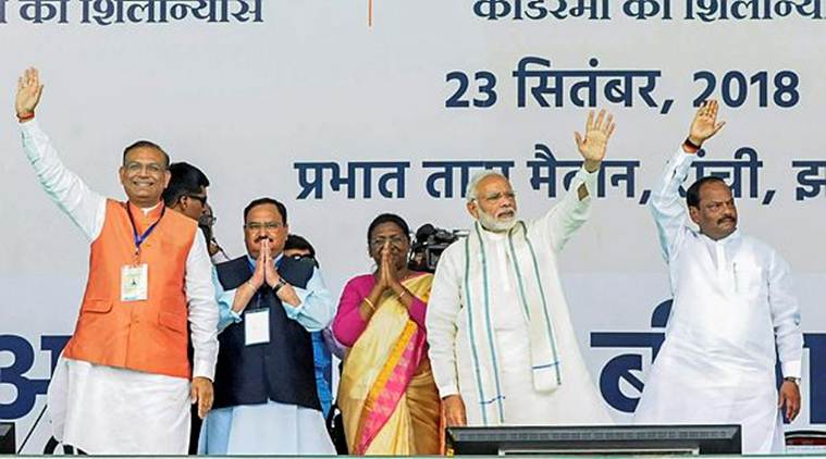 Prime Minister Narendra Modi with (L-R) Minister of State for Civil Aviation Jayant Sinha, Union Health Minister JP Nadda, Jharkhand Governor Droupadi Murmu and Chief Minister Raghubar Das wave at their supporters during the launch of Ayushman Bharat-National Health Protection Mission in Ranchi on Sunday. (PTI)