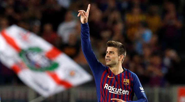 Barcelona's Gerard Pique celebrates scoring their second goal against Girona in La Liga