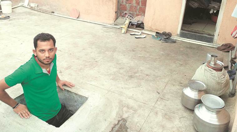 Raj Kumar Singh at his house on the second storey of a toilet block in Chinchwad. (Express photo)