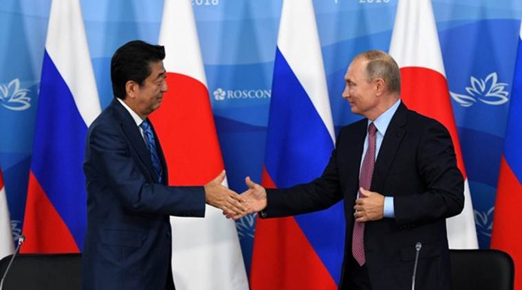Russia's Vladimir Putin tells Japan's Shinzo Abe: 'Let's sign peace deal this year'