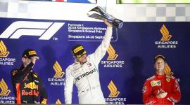 Mercedes' Lewis Hamilton celebrates on theÊpodiumÊafter winning the race alongside second placed Red Bull's Max Verstappen and third placed Ferrari's Sebastian Vettel