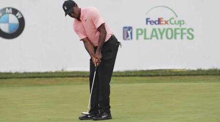 Tiger Woods putts on the 18th hole during the second round of the BMW Championship golf tournament at Aronimink Golf Club in Newtown Square, Pa., Friday, Sept. 7, 2018. (David Swanson/The Philadelphia Inquirer via AP)
