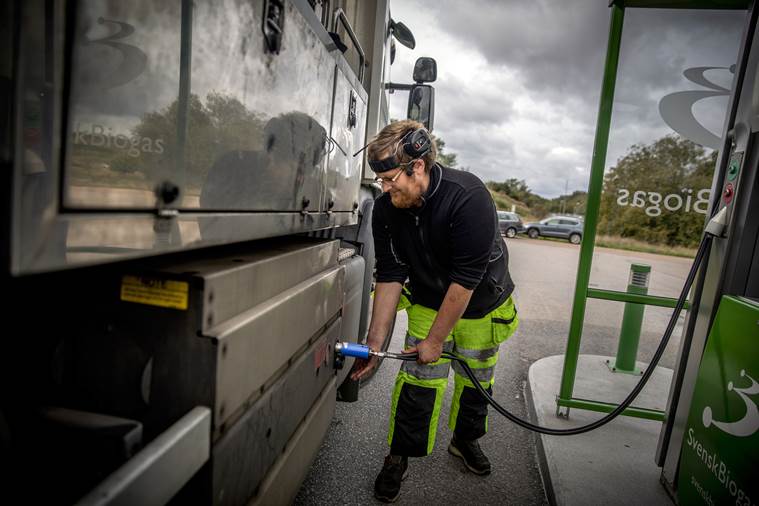 Man fills his truck with methane biogas