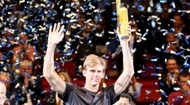 Kevin Anderson of South Africa poses with the trophy amidst a shower of confetti after winning the final match against Japan's Kei Nishikori after their final match at the Erste Bank Open tennis tournament in Vienna, Austria