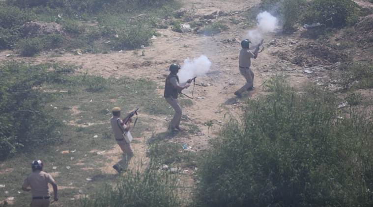 Police use teargas shells to disperse the protesters along the Delhi-Uttar Pradesh border on Tuesday. (Express photo/Gajendra Yadav)