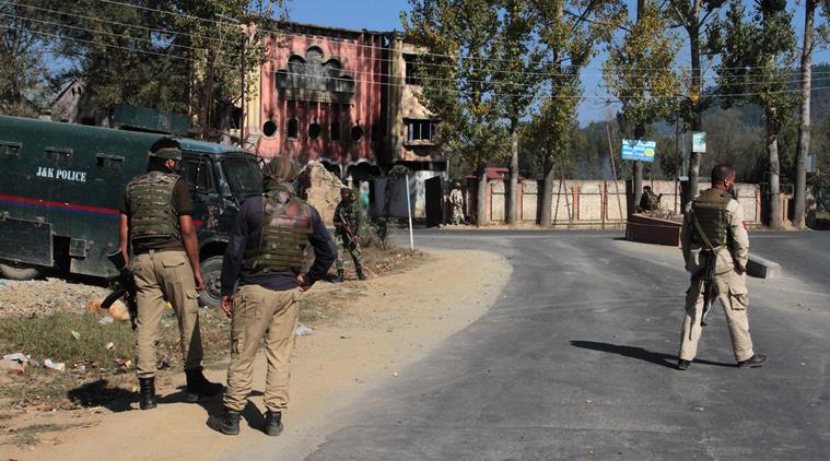 Jammu and Kashmir police men stop a media in Handwara during voting began for the first phase of the urban local bodies (ULB) elections in Jammu and Kashmir. (Express Photo by Shuaib Masoodi 08-10-2018)