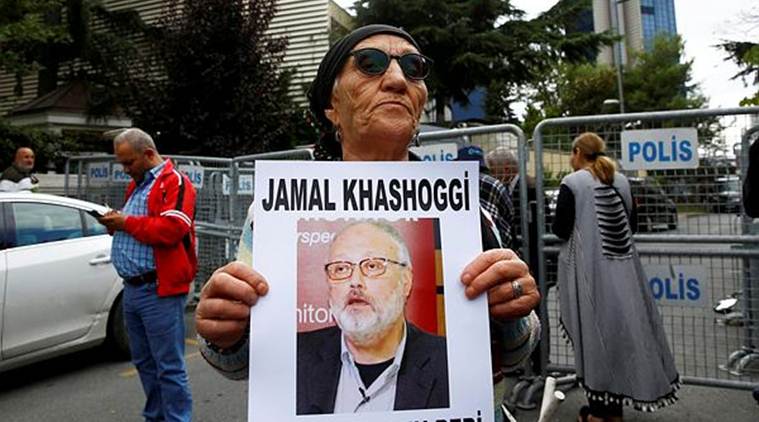A human rights activist holds picture of Saudi journalist Jamal Khashoggi during a protest outside the Saudi Consulate in Istanbul. (Reuters)