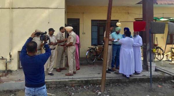 Police outside Father Kuriakose Kattuthara's room at St. Mary’s church in Dasuya on Monday. (Express photo)