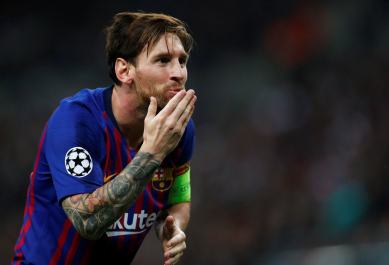Barcelona's Lionel Messi celebrates scoring their third goal against Tottenham