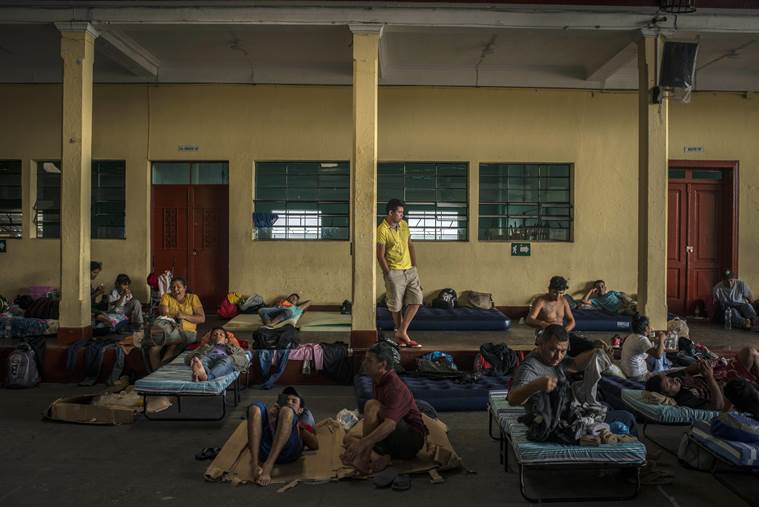 Migrants, nearly all Hondurans, rest at a school in Guatemala City.