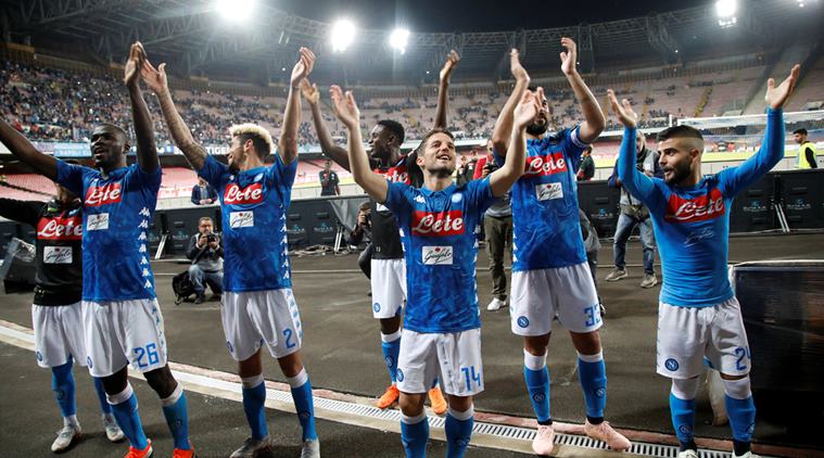 Napoli players celebrate in front of fans after the match