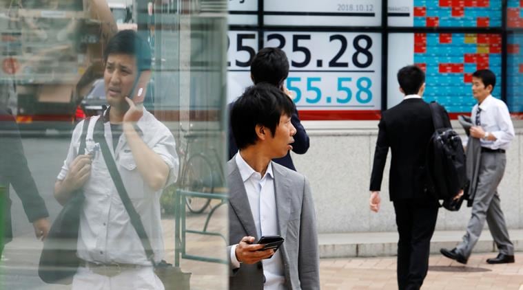 Japan's Nikkei hits nine-month low after Fed's stance dampens mood