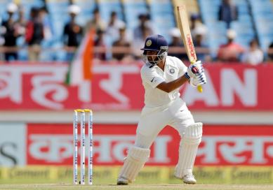 Indian cricketer Prithvi Shaw bats during the first day of the first cricket test match between India and West Indies in Rajkot