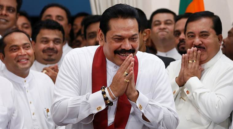 Sri Lanka's newly appointed Prime Minister Mahinda Rajapaksa gestures during a ceremony to assume charge as PM